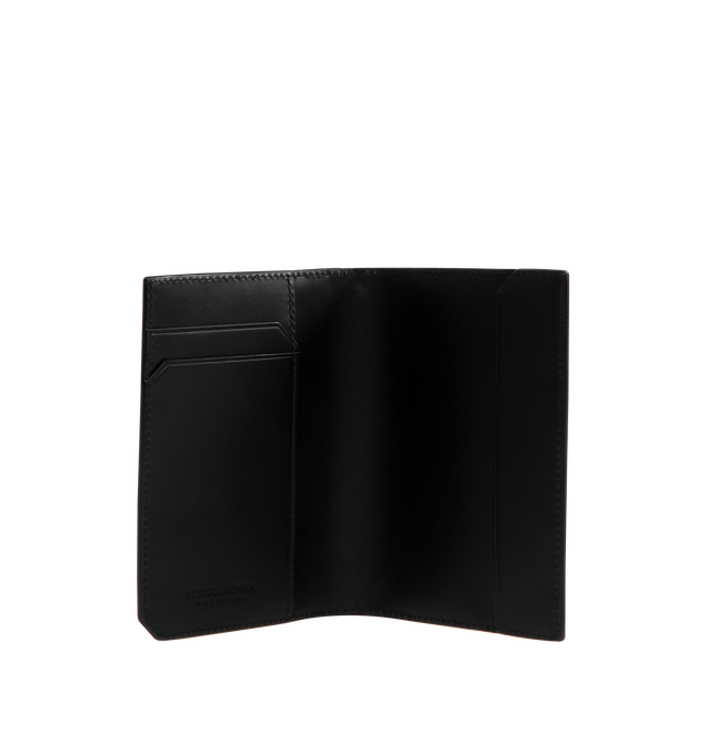 Image 3 of 3 - BLACK - Bottega Veneta Intrecciato Passport Holder has 5-card slots, 2 patch pockets, and a woven exterior design. 100% calfskin leather. H 5.25 X W 3.75 inches. Made in Italy. 