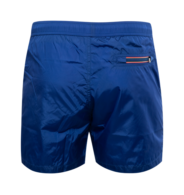 Image 2 of 3 - BLUE - MONCLER Swim Shorts featuring waistband with drawstring fastening, side pockets, zipped back pocket and silicone logo patch. 100% polyamide/nylon. 