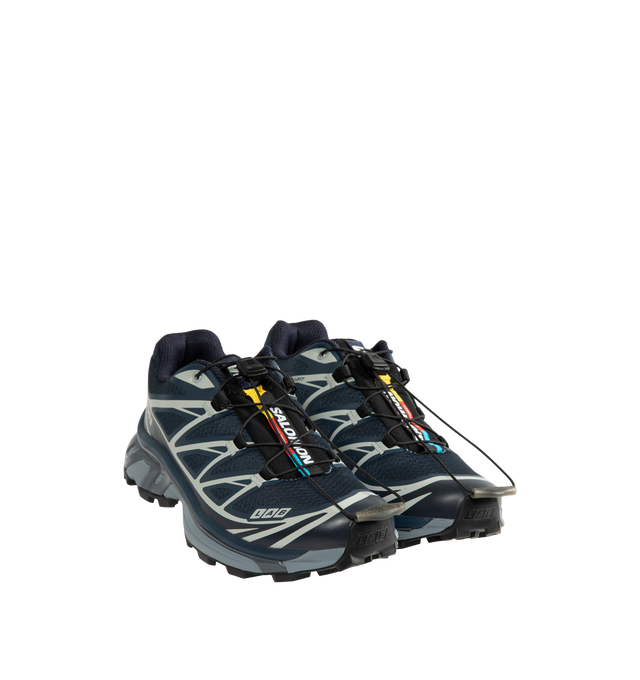 Image 2 of 5 - BLUE - Salomon Unisex XT-6 Steel Streets Sneakers are crafted from synthetic and textile materials and feature the iconic XT-6 silhouette reimagined with reflective metallic yarn and 3D mesh construction. Inspired by the raw energy of the city, this modern update enhances the model's signature SensiFit technology with a metallic finish, delivering a bold, high-shine look while maintaining the performance features that made the XT-6 a trail-running staple. Main Material: Synthetic and Textile  