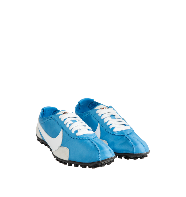 Image 2 of 5 - BLUE - Nike Men's Moon Shoe OG SP Sneakers feature an Italy Blue and Neutral Grey nylon upper with black and white accents and a leather Swoosh. Inspired by Nike's original 1970s running shoe, the streamlined silhouette is finished with a rubber Waffle outsole for durable traction. Upper: Nylon and Leather. Sole: Rubber. 