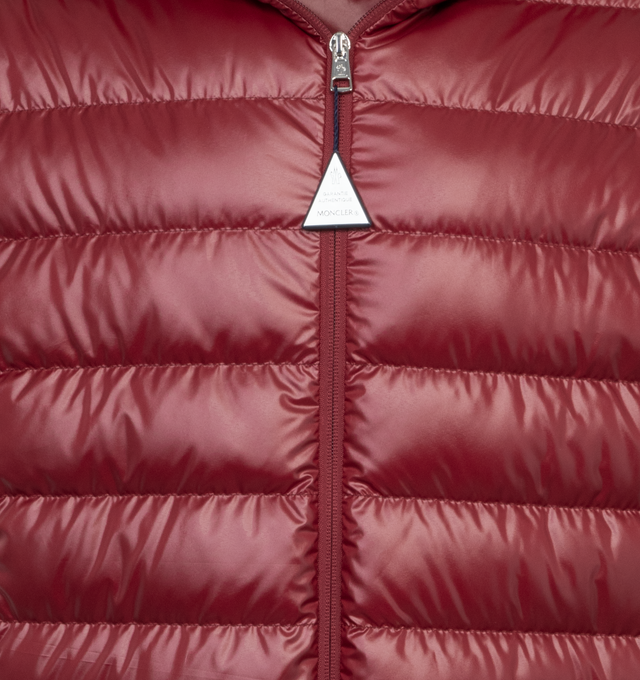 RED - MONCLER Cornour Padded Jacket featuring two-way zip fastening, adjustable hood, padded insulation, and rubberised logo and striped detailing across the hood. 100% polyester.