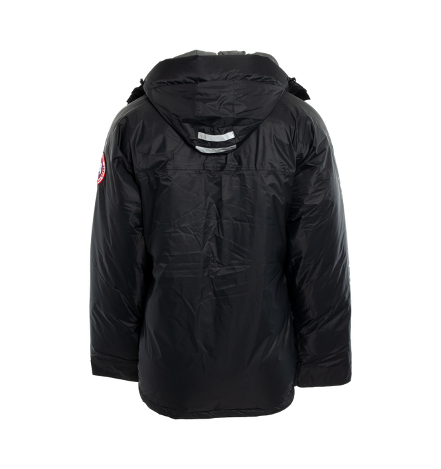 Image 2 of 3 - BLACK - CANADA GOOSE Skreslet Parka featuring 2 Napoleon chest pockets and 2 front pockets, both with water-repellent zipper closures, extra-long sleeves for coverage and mobility, fleece-lined chin guard, fully seam sealed for wind and wet weather protection, interior Pocket: 1 large inner lower mesh pocket designed to hold a water bottle, oversized down hood is adjustable and has a shaping wire for added protection and wide sleeve cuffs with Velcro closure for ease of use and venting. 100%  