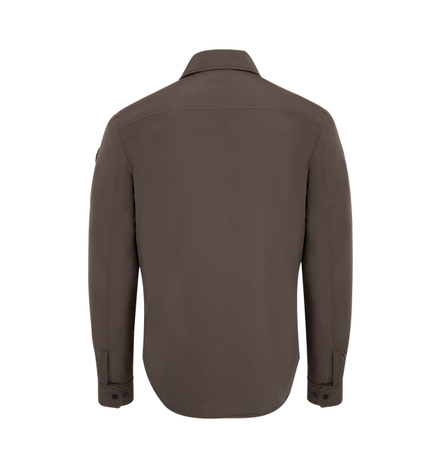 Image 2 of 3 - BROWN - MONCLER Gascogne Down Shirt Jacket featuring water-repellent main fabric, Airsoft lining, down-filled, zip and snap button closure, zipped pockets with nubuck trim, zipped inner and patch pockets, adjustable cuffs, fabric description label and leather logo patch. 100% polyester. Padding: 90% down, 10% feather. Made in Romania. 