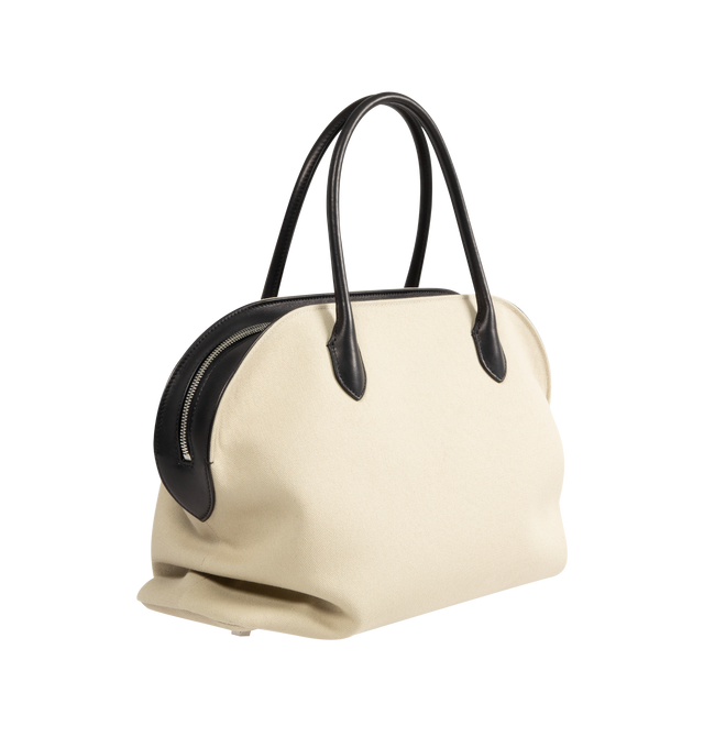 Image 2 of 3 - NEUTRAL - The Row Womens Agnes 15 Canvas Bag is crafted from cotton canvas and cattle leather. Features slim shoulder straps, an open interior with cotton lining, and saddle leather trim. Main Material: Cotton and Cattle Leather; Lining: Cotton. Dimensions: 17.52" W x 9.85" H x 8.66" D; Shoulder Strap Drop: 6.7". Made in Italy. 
