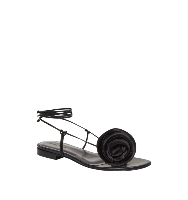 Image 2 of 3 - BLACK - Magda Butrym Wrap Around Flat Flower Sandals have long wrap tie ankle straps, silk flower details, and leather uppers and soles. 100% leather.  