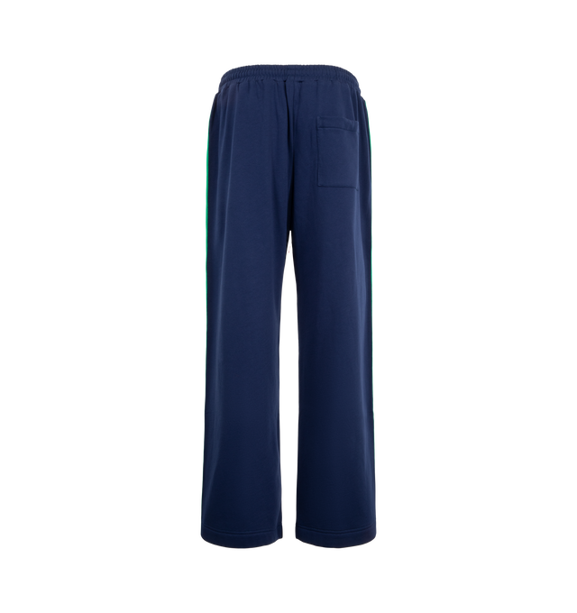 Image 2 of 3 - NAVY - Mira Mikati Women's Striped Rib Jogger with Contrast Poppers is crafted from organic cotton brushback fleece and features a wider, relaxed-fit silhouette designed for elevated everyday comfort. Finished with functional poppers along custom striped rib side panels, an elasticized waistband, and a signature plaited drawcord, this contemporary jogger blends sporty detailing with the brand's playful design aesthetic. Main Material: 100% Organic Cotton. 