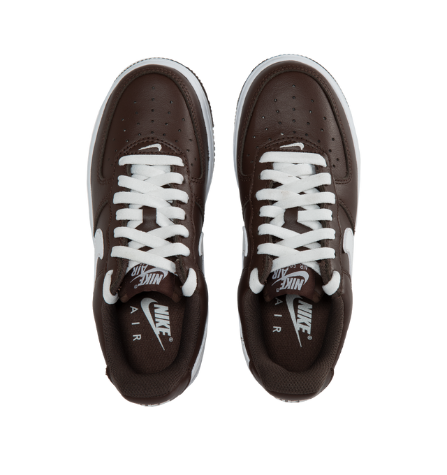 BROWN - NIKE AIR FORCE 1 LOW RETRO features leather upper, Nike Air cushioning, rubber outsole with heritage hoops pivot circles, low-cut style and padded collar.
