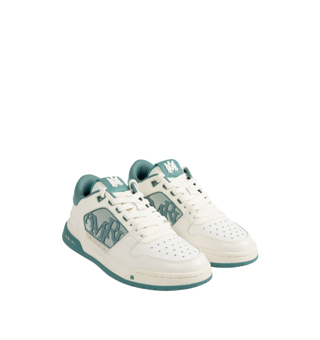 Image 2 of 5 - BLUE - Amiri Men's Classic Low Sneaker is a lace-up style crafted on a rubber sole with leather upper and central panels of molded rubber mesh framing the AMIRI staggered logo. Made in Vietnam. Upper: Leather. Sole: Rubber. 