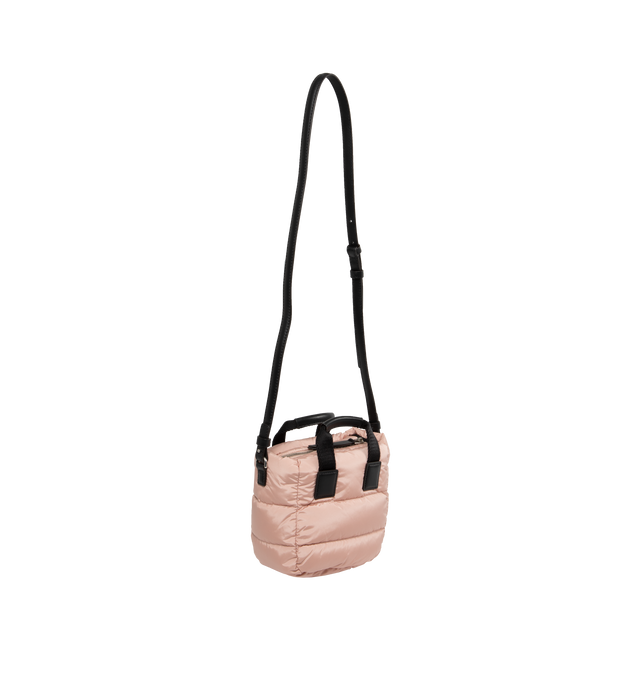 Image 2 of 3 - PINK - MONCLER Micro Caradoc Puffer Crossbody Tote featuring recycled water-repellent nylon, nylon drill lining, down-filled, ribbon handles with leather grip, adjustable and removable leather shoulder strap, zip closure and leather and metal logo. L 16.5 cm x H 13 cm x D 8 cm. 100% polyamide/nylon. Lining: 95% cotton, 5% acrylic. Padding: 90% down, 10% feather. 