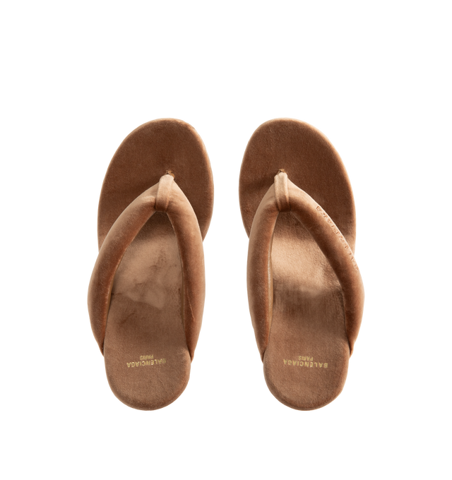 Image 4 of 4 - BROWN - Balenciaga Womens Gaeta Wedge Thong Sandals are crafted from a plush stretch velvet material. Feature a round toe, padded thong strap, slip-on design, 90mm arch wedge heel, and leather sole. Upper: cotton, viscose, elastane, Sole: calfskin, Insole: cotton, viscose, elastane. Made in Italy. 
