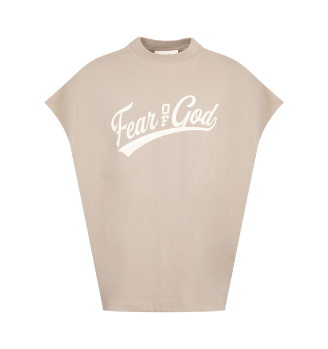 Image 1 of 2 - NEUTRAL - The Men's Fear Of God 90s Cut Off Shirt is crafted from 100% cotton jersey and designed in a boxy fit with raw, cut-off sleeves. The front features a graphic logo. The piece is finished with an Essentials label at the back collar. 