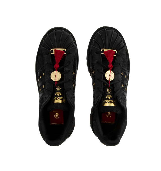 Image 5 of 5 - BLACK - Adidas Clot Superstar LNY Sneakers are a lace style with a snakeskin pattern, gold details, red string accents, and rippled rubber outsoles. Unisex style in men's sizes. 