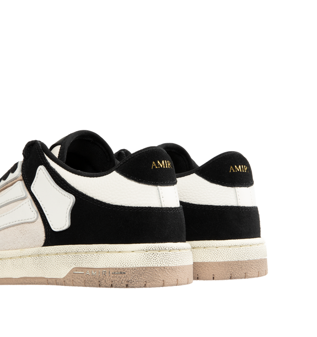 Image 3 of 5 - NEUTRAL - AMIRI Distressed Skel-Top Low Sneakers featuring appliqus throughout, perforated detailing at toe, lace-up closure, logo patch at padded tongue, padded collar, logo embossed at heel tab and treaded rubber sole. Upper: synthetic, leather. Sole: rubber.  