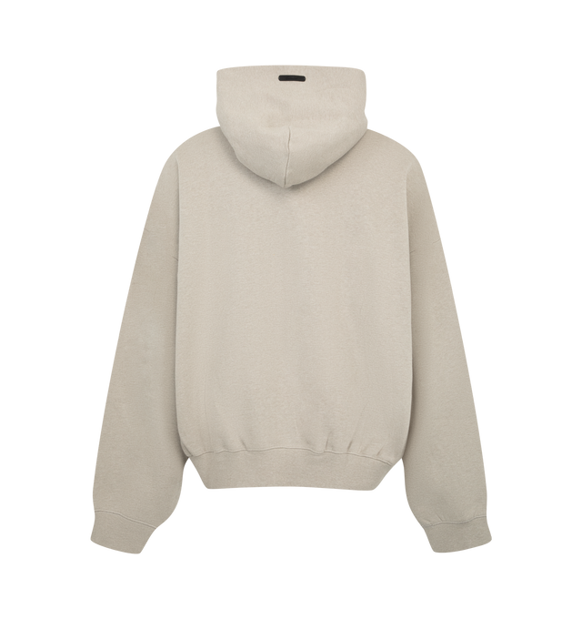 Image 2 of 2 - NEUTRAL - Fear of God ESSENTIALS Men's Signature Classic Hoodie is crafted from heavyweight 380 GSM core fleece and features a classic relaxed-fit silhouette with a double-layer hood for enhanced comfort and structure. Designed with an embroidered ESSENTIALS signature logo at the front, this elevated everyday essential is finished with a kangaroo pocket, rib-knit cuffs and hem, and a signature ESSENTIALS label at the hood edge. Main Material: 80% Cotton, 20% Polyester, 380 GSM Core Fleece. 