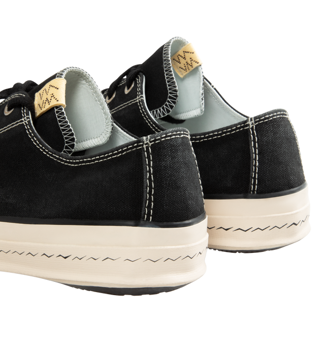 Image 3 of 5 - BLACK - VISVIM Skagway L.T. Lo Leather-Trimmed Canvas Sneakers featuring lace-up, hard-wearing canvas, leather trims, high logo-printed foxing and Vibram rubber soles. 