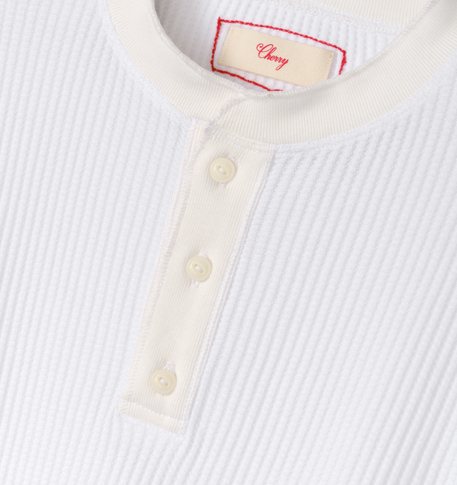 Image 3 of 6 - WHITE - Cherry LA Men's Henley Thermal is crafted from a custom poly-cotton thermal fabric and features a fitted silhouette with a classic Henley neckline. Designed with embroidered detailing at the back and finished with two-hole cat-eye buttons, this everyday essential combines vintage-inspired thermal styling with Cherry LA's signature craftsmanship. Main Material: Custom Poly-Cotton Thermal. Made in Los Angeles, California. 