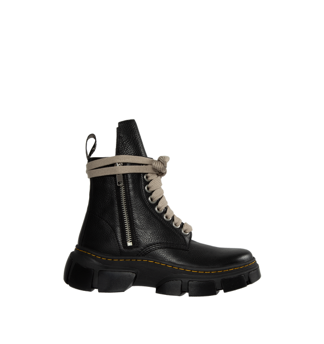 BLACK - DR. MARTENS X RICK OWENS 1460 DXML boot in black cow leather featuring exaggerated length pearl-tone laces and palladium finish hardware including eyelets  and side zipper, an extended geometric tounge and woven Dr. Martens Airware heel loop. 50% E.V.A + 50% Polivinilclorurol rubber sole with Dr. Martens yellow welt stitch. DXML outsole, an exaggerated interperetation of the classic Dr. Martens sole. 