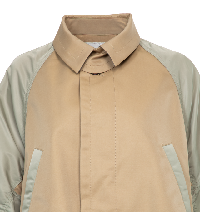 NEUTRAL - SACAI Gabardine X Nylon Twill Jacket featuring button front closure, classic collar, puff sleeves, side slip pocket and multi-panel construction. 100% nylon. 65% cotton, 35% polyester.