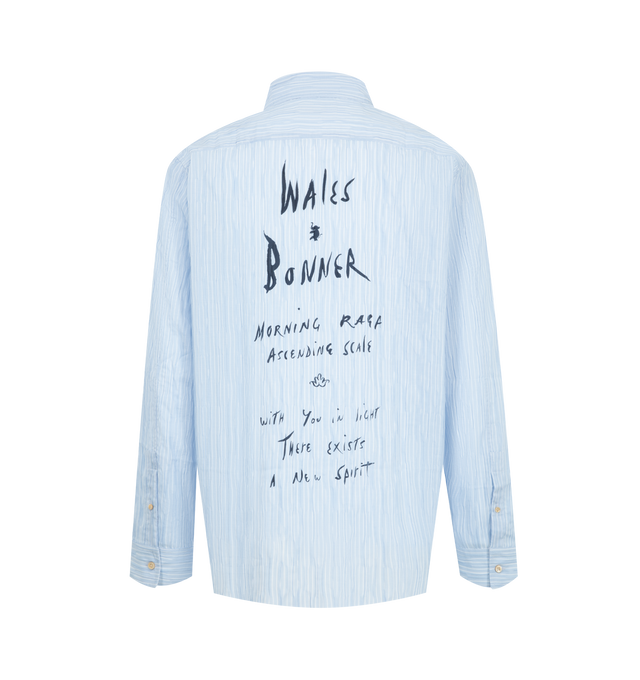 Image 2 of 2 - BLUE - Wales Bonner Men's Atlantic Shirt is crafted from soft cotton pliss stripe fabric and features a cornflower blue and white striped design. Tailored with a spread collar, button-front closure, buttoned barrel cuffs, and a shirttail hem, the shirt is finished with logo embroidery at the chest and a Morning Raga graphic print at the back. Main Material: 100% Cotton. Closure: Button Front. Collar: Spread Collar. Cuffs: Buttoned Barrel Cuffs. Detail: Logo Embroidery at Chest, Morning Raga G 