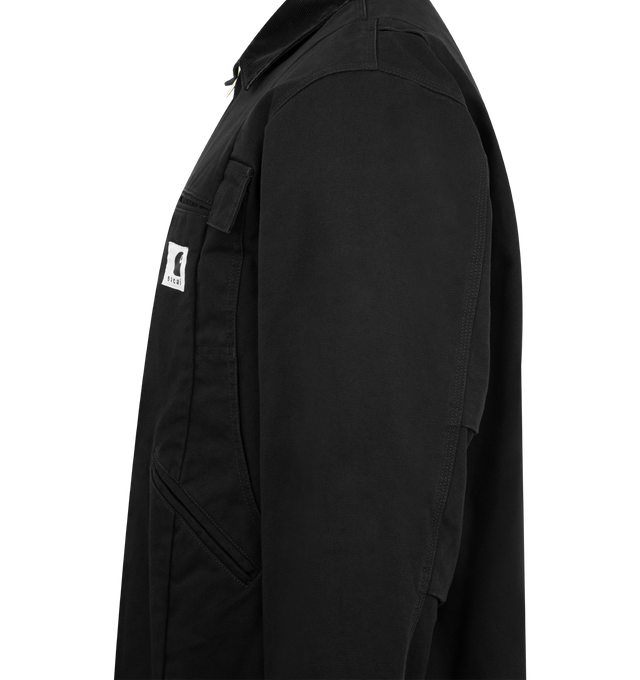 Image 3 of 3 - BLACK - SACAI X CARHARTT WIP Duck Cotton Jacket featuring spread collar, drop shoulders, long sleeves, rib-knit cuffs, chest and side welt pockets, asymmetric hem and front zip closure. 100% cotton. Made in Japan. 