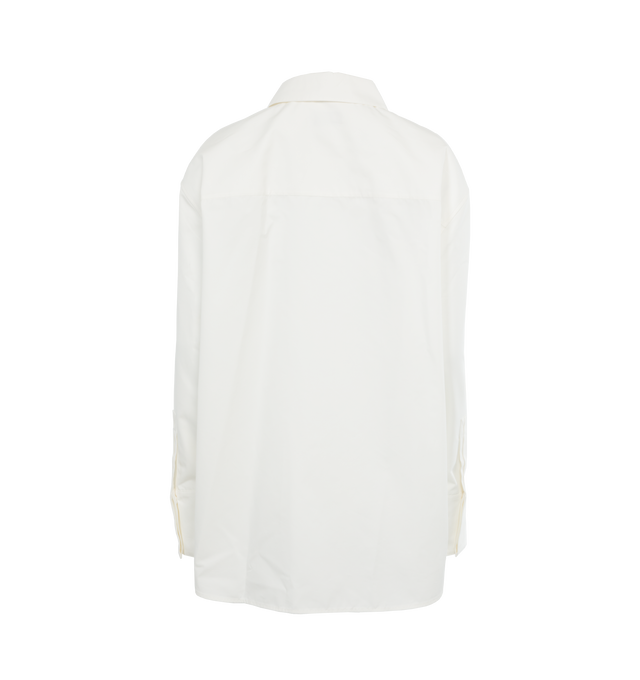 Image 2 of 3 - WHITE - Saint Laurent Oversized shirt crafted from organic cotton featuring pointed collare, drop shoulders, front-button closure, curved hem and concealed four-button cuffs. 100% cotton. Made in Italy.  