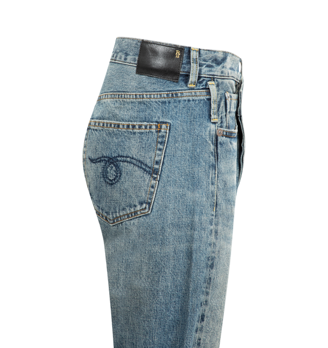 Image 3 of 3 - BLUE - R13 Crossover Jeans featuring fading, whiskering, and distressing throughout, belt loops, five-pocket styling, offset button-fly, raw edge at rolled cuffs and logo patch at back waistband. 100% cotton. Made in Italy. 