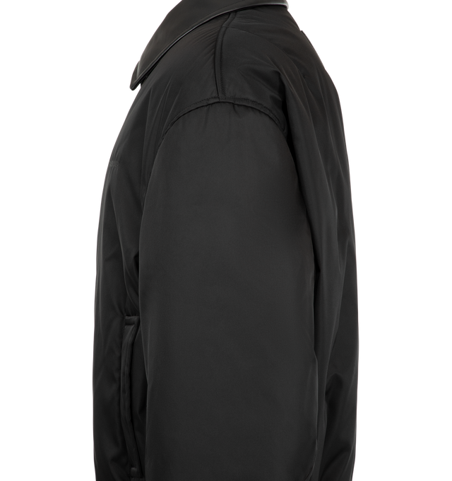 Image 3 of 3 - BLACK - Balenciaga Men's Cocoon Bomber Jacket is crafted from black cotton-blend twill and features a calfskin collar, dropped shoulders, and a single-zip closure. Two slash pockets and ribbed cuffs and hem complete the design. Main Material: 80% Cotton, 16% Polyamide, 4% Elastane. Lining: 100% Polyester. Filling: 100% Polyester. Embroidery: 100% Polyester. Leather Detail: Calfskin. Made in Italy. 