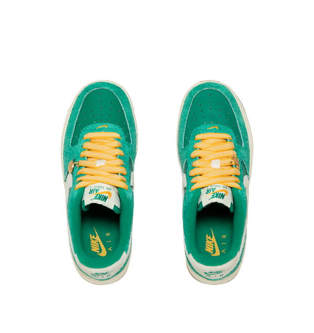 Image 5 of 5 - GREEN - Nike Women's Air Force 1 07' Game Day Sneakers feature a genuine and synthetic leather upper with a perforated toe box for breathable comfort and a timeless look. These iconic lifestyle sneakers combine lightweight Nike Air cushioning, a padded collar, and a durable rubber outsole with classic pivot-circle traction for everyday wear. Clip-on charms add a customizable finishing touch. Main Material: Genuine Leather and Synthetic Leather. Midsole: Foam with Nike Air Unit. Sole: Rubber.  