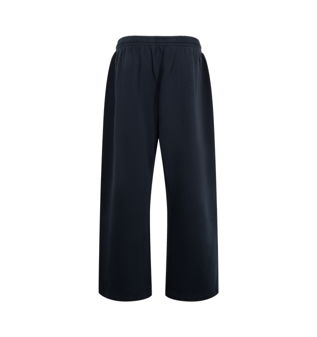 Image 2 of 3 - BLUE - Acne Studios Fleece Logo Sweatpants are crafted from brushed organic cotton fleece and feature a loose unisex silhouette with a mid-rise waist and long, baggy legs. Designed with an elasticated waistband and adjustable drawcord, these designer sweatpants are finished with side zip pockets and an embroidered seasonal logo for a signature finish. Main Material: 100% Cotton. Fit: Loose Unisex Fit. Rise: Mid-Waist. Details: Long Baggy Legs, Elastic Waistband with Drawcord, Side Zip Pockets 