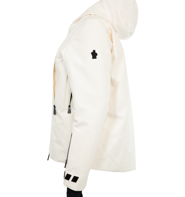 Image 3 of 3 - WHITE - Moncler Chanavey Jacket features a front 2-way zip closure, hood, zipper pockets, and cut-out detailing on the hands. An interior snow skirt helps keep the snow and cold out. 100% polyester. 90% down, 10% feathers. Made in Romania.  