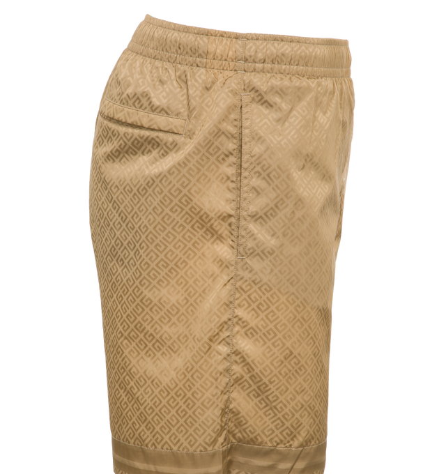 Image 3 of 5 - BROWN - GIVENCHY Long Swim Shorts featuring recycled synthetic fiber, elastic waist, diagonal 4G pattern all-over, small GIVENCHY signature on the left leg, on the front, two side pockets and one back pocket. 100% polyamide. 