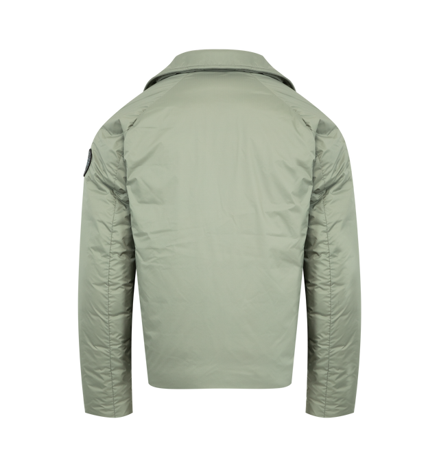 Image 2 of 3 - GREEN - CANADA GOOSE Lodge Coach Jacket featuring a pointed collar, packable into interior zip pocket, snap front closure, two exterior zippered pockets and two interior pockets: one drop-in pocket, one zippered security pocket. 100% nylon. Made in Canada. 