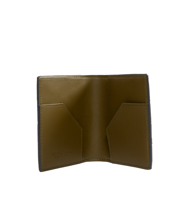 Image 2 of 3 - BLACK - BOTTEGA VENETA Intrecciato Bill Wallet featuring intrecciato calfskin leather wallet with contrasted interior, six external card slots and two internal flaps to hold bills and receipts. 3.5" x 3.9" x 0.2". Calfskin. 