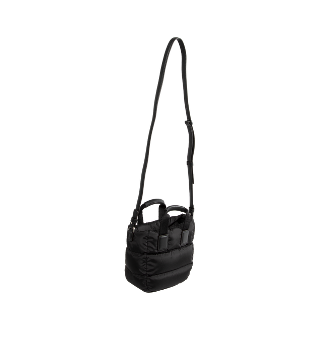 Image 2 of 3 - BLACK - MONCLER Micro Caradoc Puffer Crossbody Tote featuring quilted water-repellent nylon, trapezoid silhouette, top zip closure, top carry handles and adjustable shoulder strap. Lined with down fill. Textile with leather trim. Made in Hungary. 