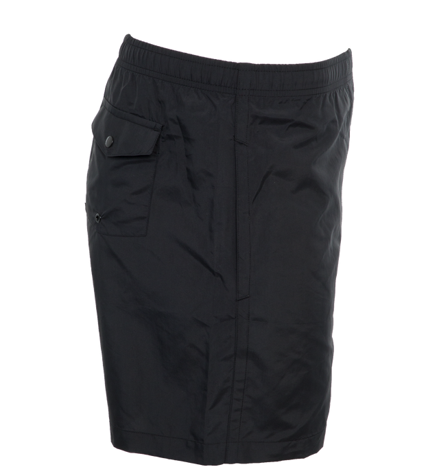 Image 3 of 4 - BLACK - NOAH CORE SWIM TRUNK crafted from 100% nylon with poly mesh liner. Elastic drawstring waist, on-seam front pockets, flap back pocket with snap closure and drain vent.  Ultralight and quick-drying, as high-performing in the water as they are on land. Featuring solid proportions, functional pockets, an essential summer staple. Made in Portugal. 