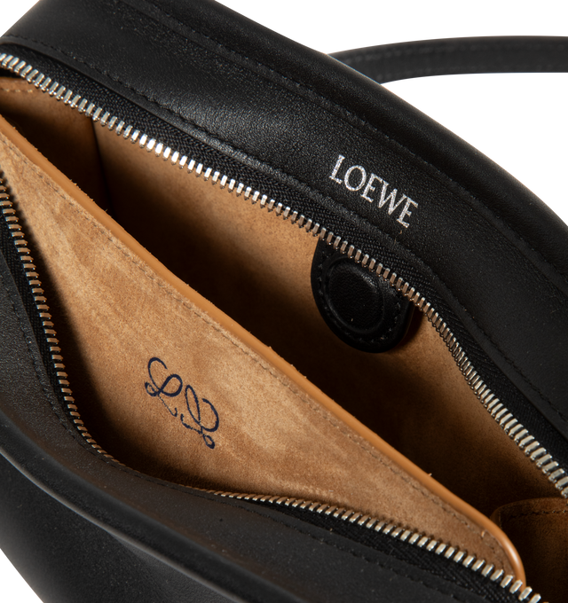 Image 4 of 4 - BLACK - Loewe Mini Amazona 180 Bag in leather features a relaxed silhouette anchored by a single toron top handle, designed to be carried open, while a concealed closure secures the main compartment, removable shoulder and crossbody straps, two carry options: short handle, removable and adjustable crossbody strap, zip closure with two leather zip pullers, two compartments, main compartment closed with magnetic closure, left side d-ring for customization, suede and nappa lambskin lining, and e 