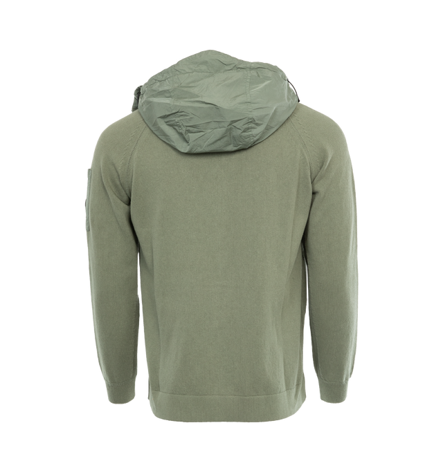 Image 2 of 3 - GREEN - C.P. COMPANY Cotton Mixed Hooded Knit featuring stand-up collar, adjustable hood, full zip fastening, lens detail, kangaroo pockets, ribbed cuffs, 7 gauge knit thickness and regular fit. 100% cotton. 