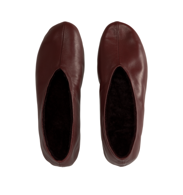 Image 4 of 4 - RED - The Row Women's Stella Slippers are crafted from smooth nappa lambskin leather and feature a slip-on silhouette with an oval toe, soft shearling lining, and a flexible rubber-coated sole. These designer leather slippers combine exceptional Italian craftsmanship with luxurious comfort, making them an elevated choice for effortless everyday wear. Main Material: 100% Lambskin Leather. Lining: Shearling. Sole: Rubber-Coated. Made in Italy. 