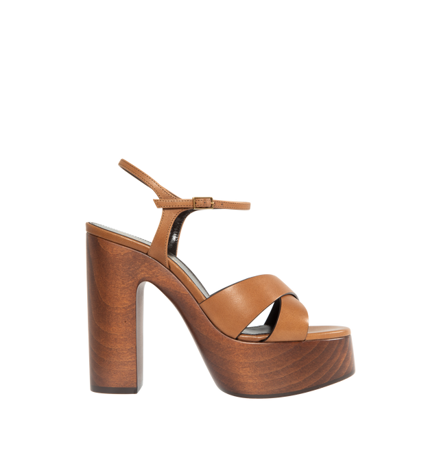 Image 1 of 4 - BROWN - SAINT LAURENT Bianca Platform Sandal featuring an adjustable ankle strap, wooden block heel and leather sole. 4.9 inches total heel height. 1.6 inch platform. 100% calfskin leather. 