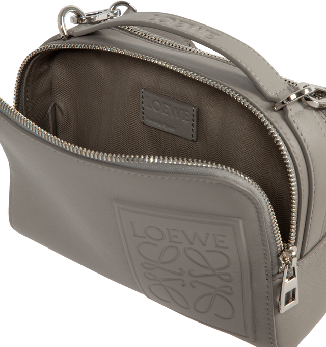 Image 5 of 5 - GREY - Loewe Mini crossbody camera bag in satin calfskin with two zipped compartments anbd debossed LOEWE Anagram patch. Crossbody or hand carry with adjustable and detachable LOEWE webbing strap. Herringbone cotton canvas lining. 