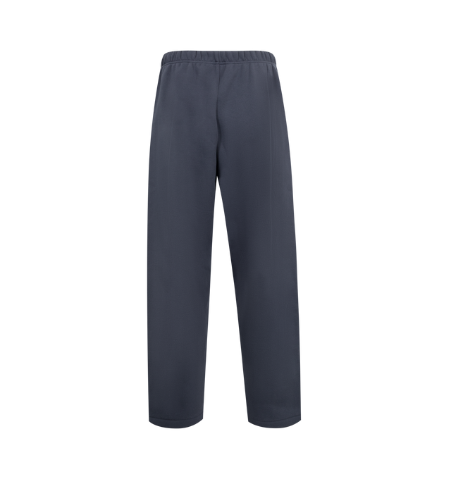 Image 2 of 2 - NAVY - FEAR OF GOD ESSENTIALS Fleece Relaxed Sweatpant featuring a straight leg, drawstring fastening, elasticated waistband, side seam pockets, and screen print design. 80% Cotton, 20% Polyester. 