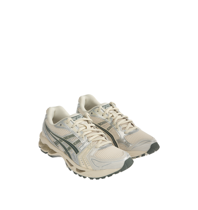 Image 2 of 5 - WHITE - Asics GEL-Kayano 14 Sportstyle Sneakers are lace-up style with rip-stop underlays, GEL cushioning, and TRUSSTIC support system. Unisex style in men's sizes. 