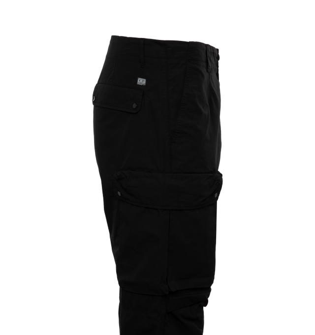 Image 3 of 3 - BLACK - C.P. COMPANY Rip-Stop Loose Utility Cargo Pants featuring zip fly and button fastening, reinforced belt loops, slanted hand pockets, single buttoned back pocket, multiple secure leg pockets, lens detail, adjustable leg openings, garment dyed and loose fit. 100% cotton. 