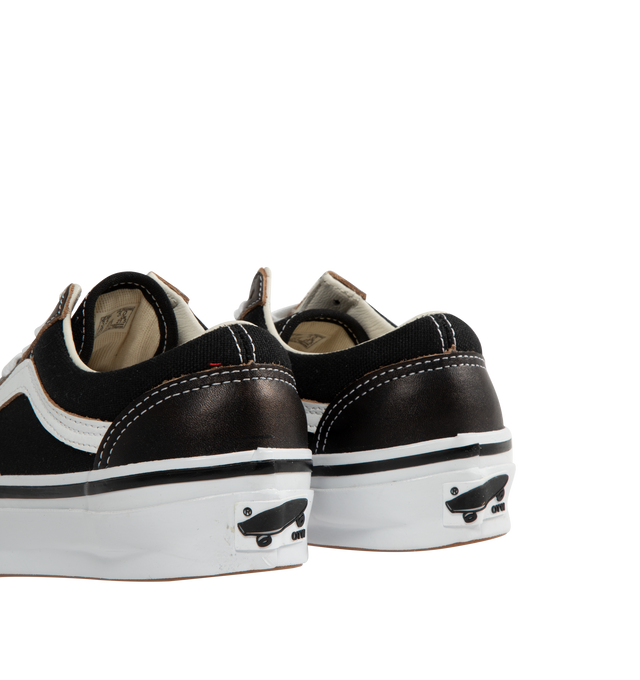 Image 3 of 5 - BLACK - VANS OTW Old Skool 36 Vibram Sneaker featuring canvas upper, leather overlay at tongue, toe, and heel wrap, padded collar, formstripe at lateral sides, topstitched construction, flat cotton laces, VANS rubberized logo patch at heel and vibram rubber outsole.  