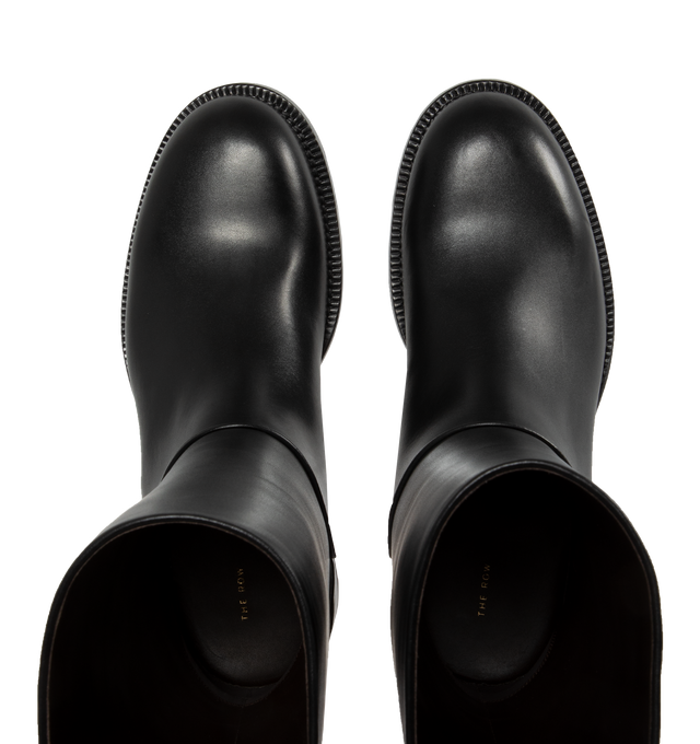 Image 4 of 4 - BLACK - THE ROW Nobilis Riding Boot featuring classic riding boot in silky polished leather with round toe and stacked heel. 1.4 in. heel. 100% calfskin leather. Lined in 100% leather. Made in Italy. 