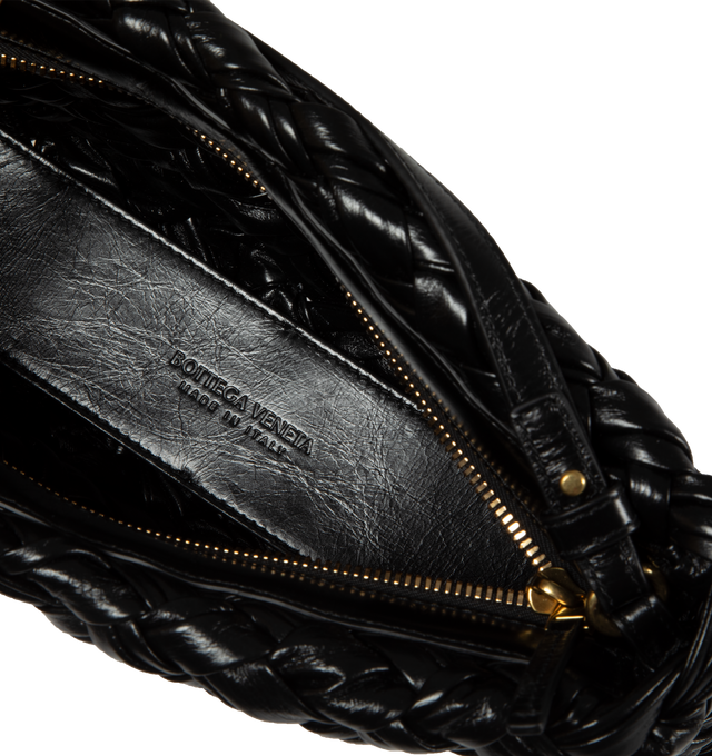 Image 3 of 3 - BLACK - BOTTEGA VENETA Kalimero Cha-Cha Foulard Intreccio leather clutch bag with detachable and adjustable strap. Features one main unlined compartment, detachable and adjustable leather strap, zip closure, brass-tone hardware. 100% Calfskin. Height 5.5" X  Width 9.8". Strap drop 8.7".  Made in Italy. 