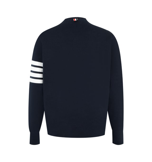 Image 2 of 2 - NAVY - THOM BROWNE Classic Loopback 4-Bar Sweatshirt featuring crew neckline with v patch, engineered 4-bar stripe detail at left sleeve, name tag applique above hem, buttoned side vents with signature striped grosgrain trim and signature striped grosgrain loop tab at back of neck. 100% cotton. Made in Japan. 