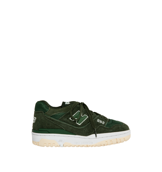 Image 1 of 5 - GREEN - The New Balance 550 debuted in 1989 and made its mark on basketball courts from coast to coast. Returning from the archives, this global fashion favorite features a low top, streamlined silhouette with leather, synthetic, and mesh upper and rubber outsole for traction and durability. 