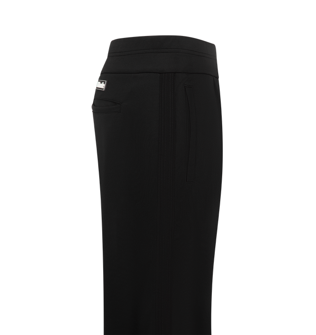 Image 3 of 3 - BLACK - The Rhude Men's Trofeo Track Pants feature a  sleek silhouette cut from a luxurious stretch polyester jersey. These track pants feature a drawstring waist, side slip pockets, and a back welt pocket keep things functional, while zipped cuffs add a sharp, sporty finish. Materials: 98% Polyester 2% Elastane. 