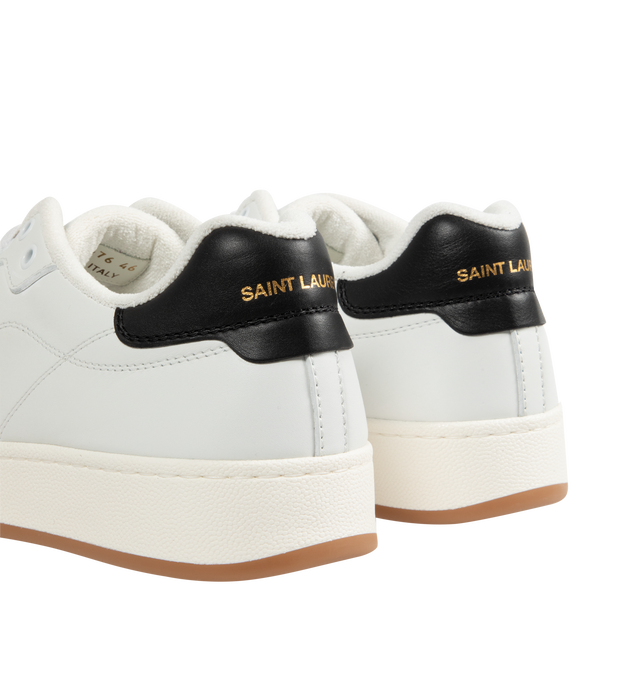 Image 3 of 5 - WHITE - Saint Laurent SL61 Sneakers are a lace-up style with perforated leather at the front, gold-tone logos at the pull tabs and along the sides, and rubber soles. 100% leather. Made in Italy.  